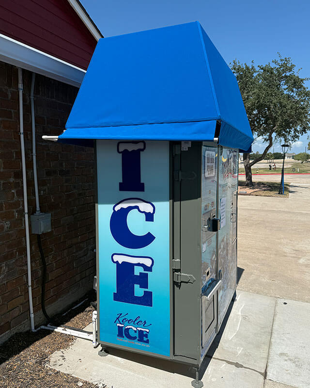 Side view of the ice vending machine with vertical ICE branding