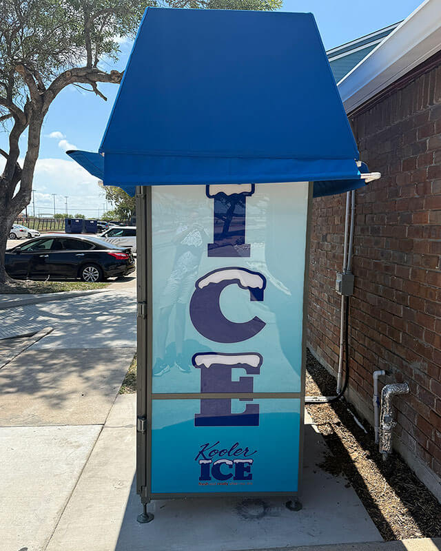 Alternate side view of the ice vending machine with vertical ICE lettering