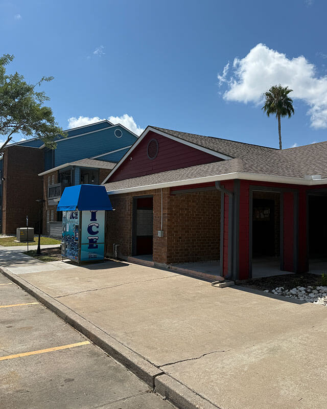 Ice vending machine located within the apartment community near the buildings